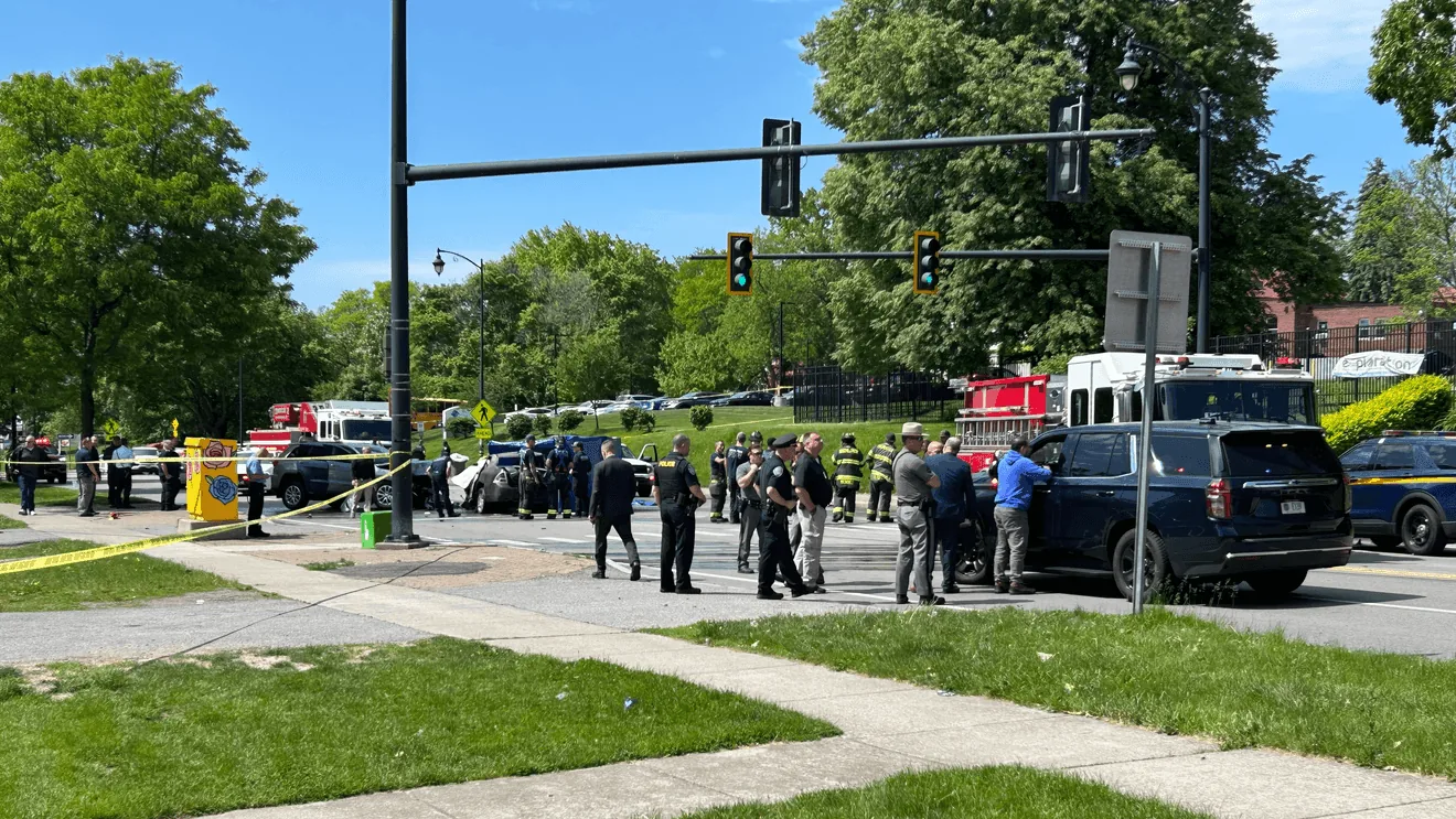 Police investigate a burned car after a crash in Rochester's Maplewood neighborhood