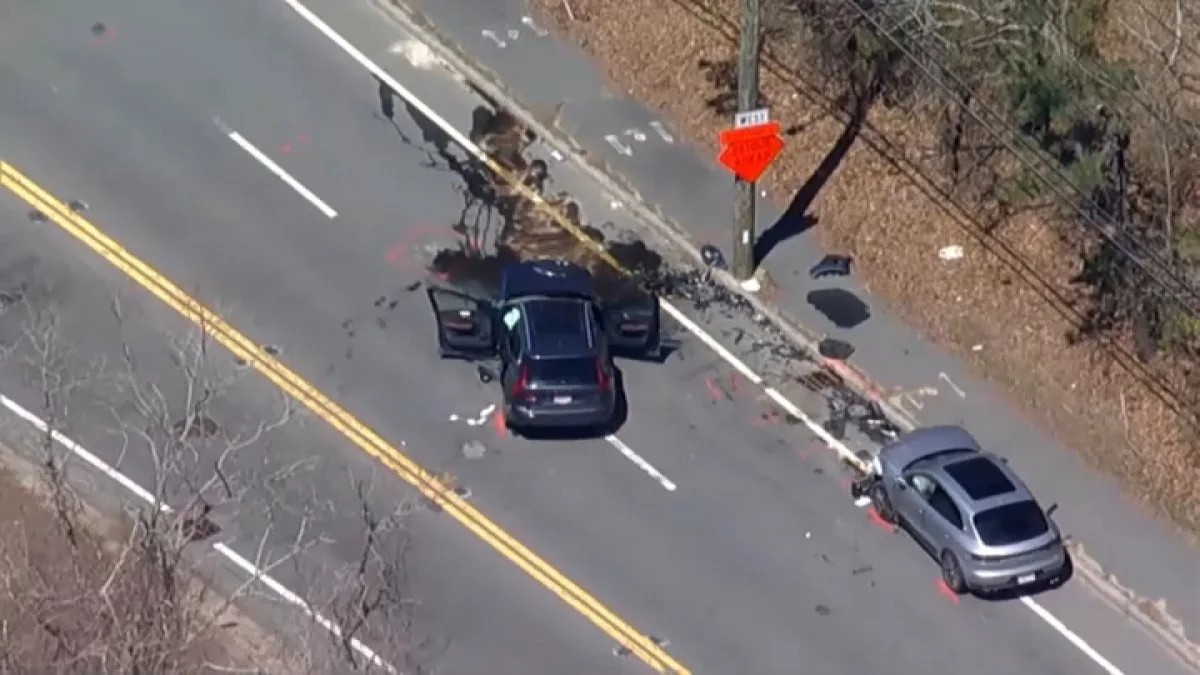 Police investigators at a crash scene on Route 3A in Plymouth after a head-on collision
