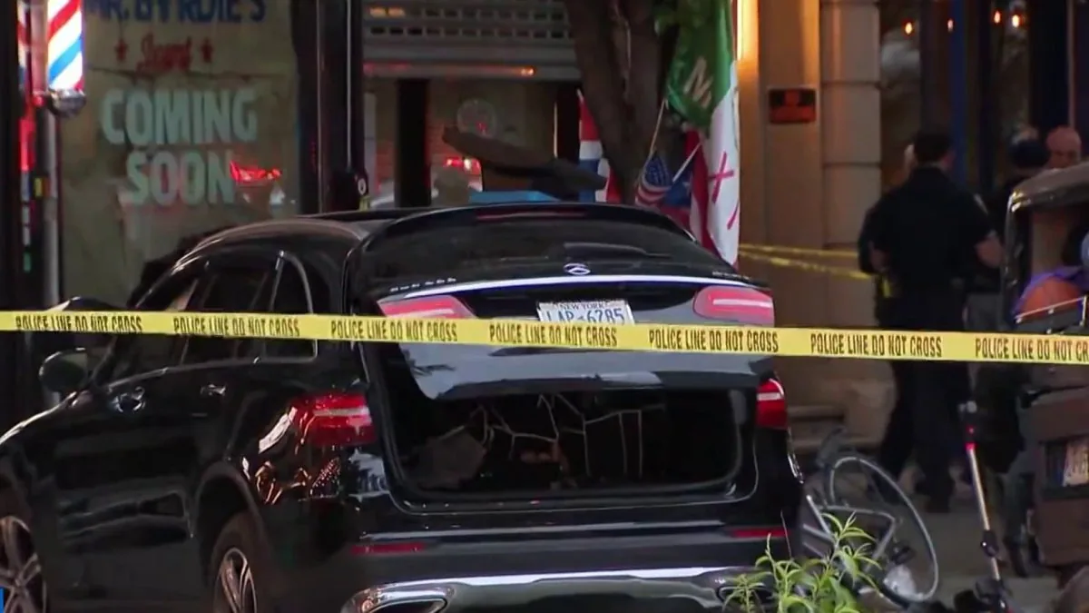Police investigate a sidewalk crash near a barbershop on Manhattan's Upper West Side