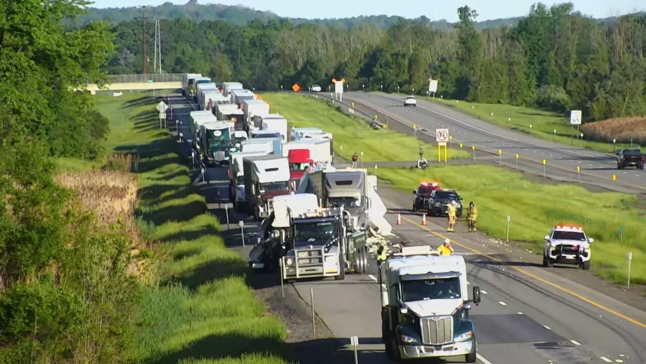 Traffic on a highway after a tractor-trailer crash caused lane closures in Ontario County