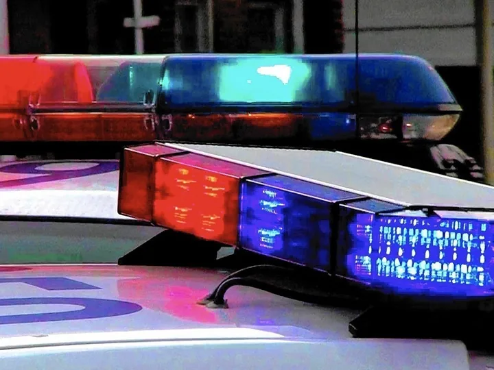 Police investigate a fatal head-on crash scene on a Connecticut road at night