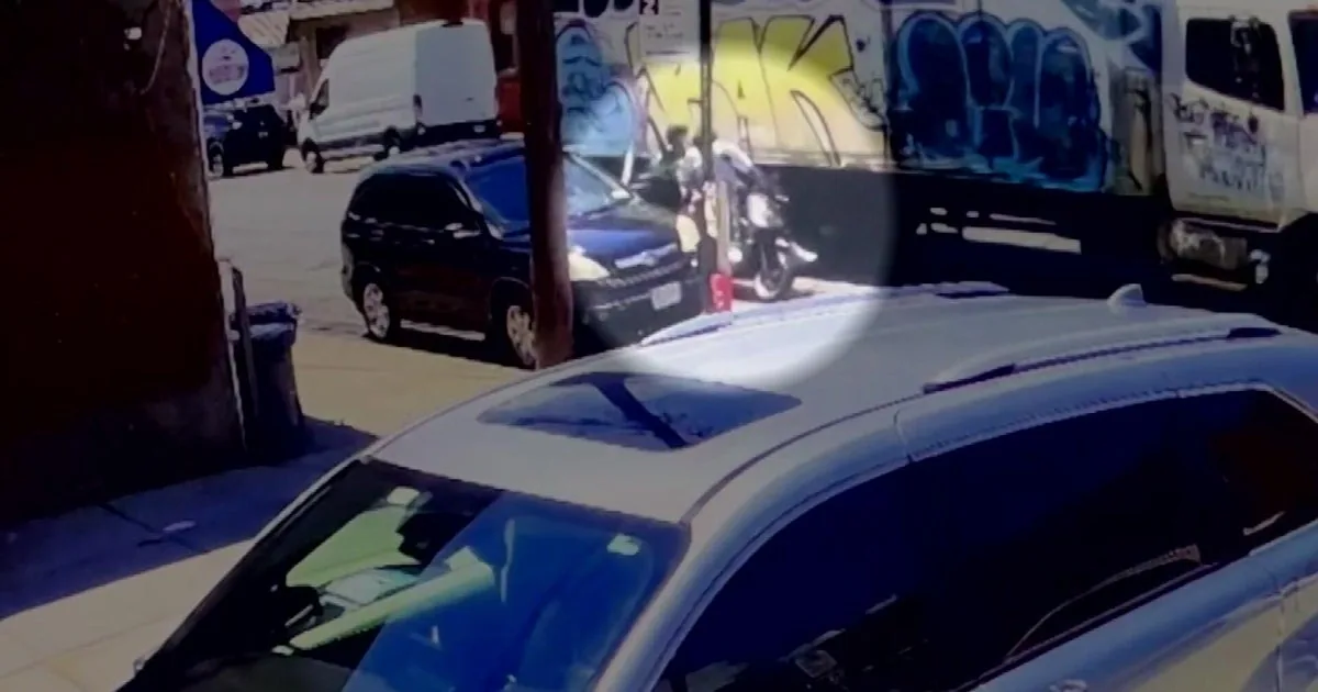 Police investigate a moped crash in Queens after a parked SUV door was opened