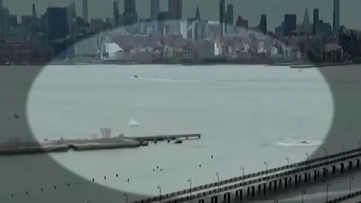 A helicopter over the Hudson River as investigators examine a fatal crash
