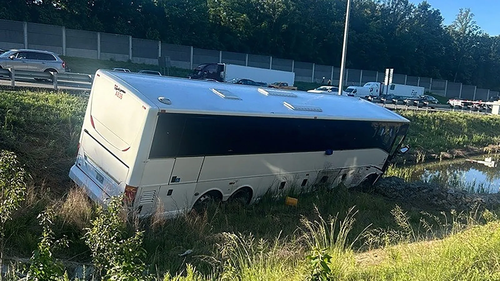A damaged bus and other vehicles after a deadly multi-vehicle crash on I-95 in Virginia